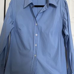 It’s A Beautiful Woman’s Shirt In Size 12 The Color Is baby blue made by Michael Kors