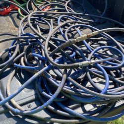 About 75 Feet Of Air Hose With An Air Nozzle On The End