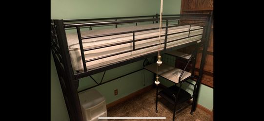 Black metal twin loft bed with built-in attached desk. Includes hardware.