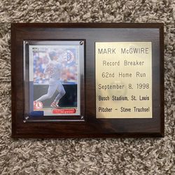 framed collectible display plaque featuring a Mark McGwire baseball card and an engraved brass plate