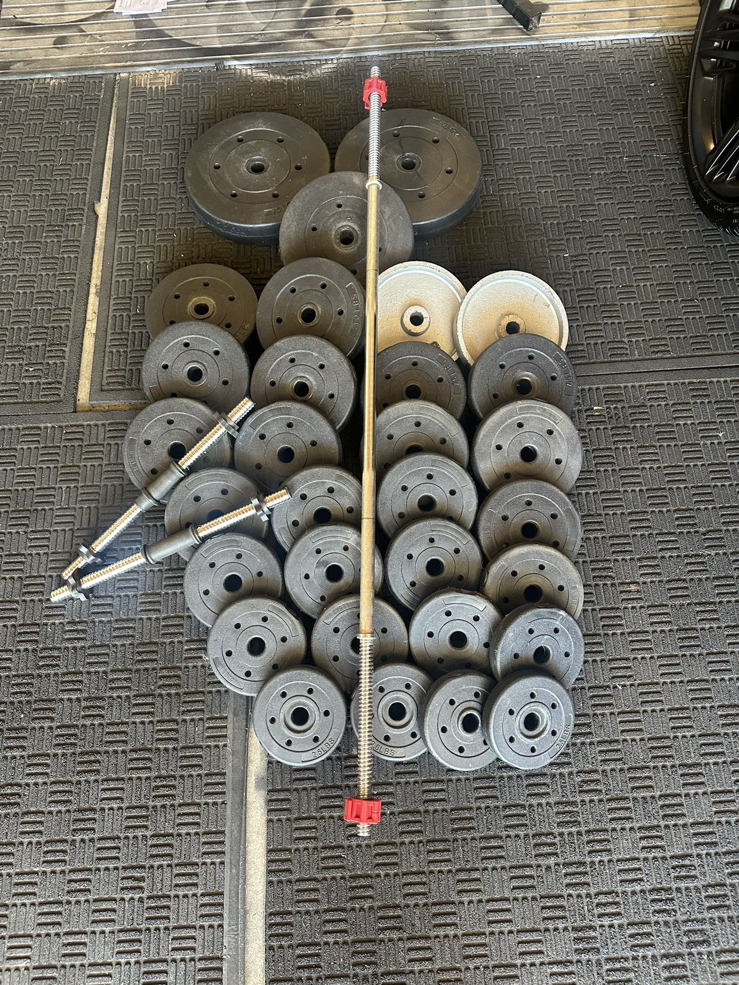 Standard weights 208lbs total plus 6ft bar plus adjustable dumbbells