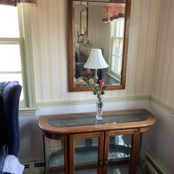 Curio cabinet with matching mirror