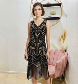 NEW WITHOUT TAG, Medium . Elegant black and gold sequined flapper dress