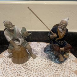 2 vintage porcelain fisherman