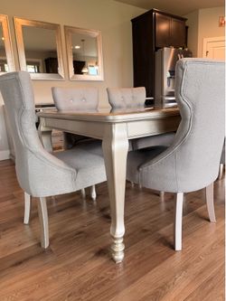 Ashley contemporary dinning table with 6 matching chairs