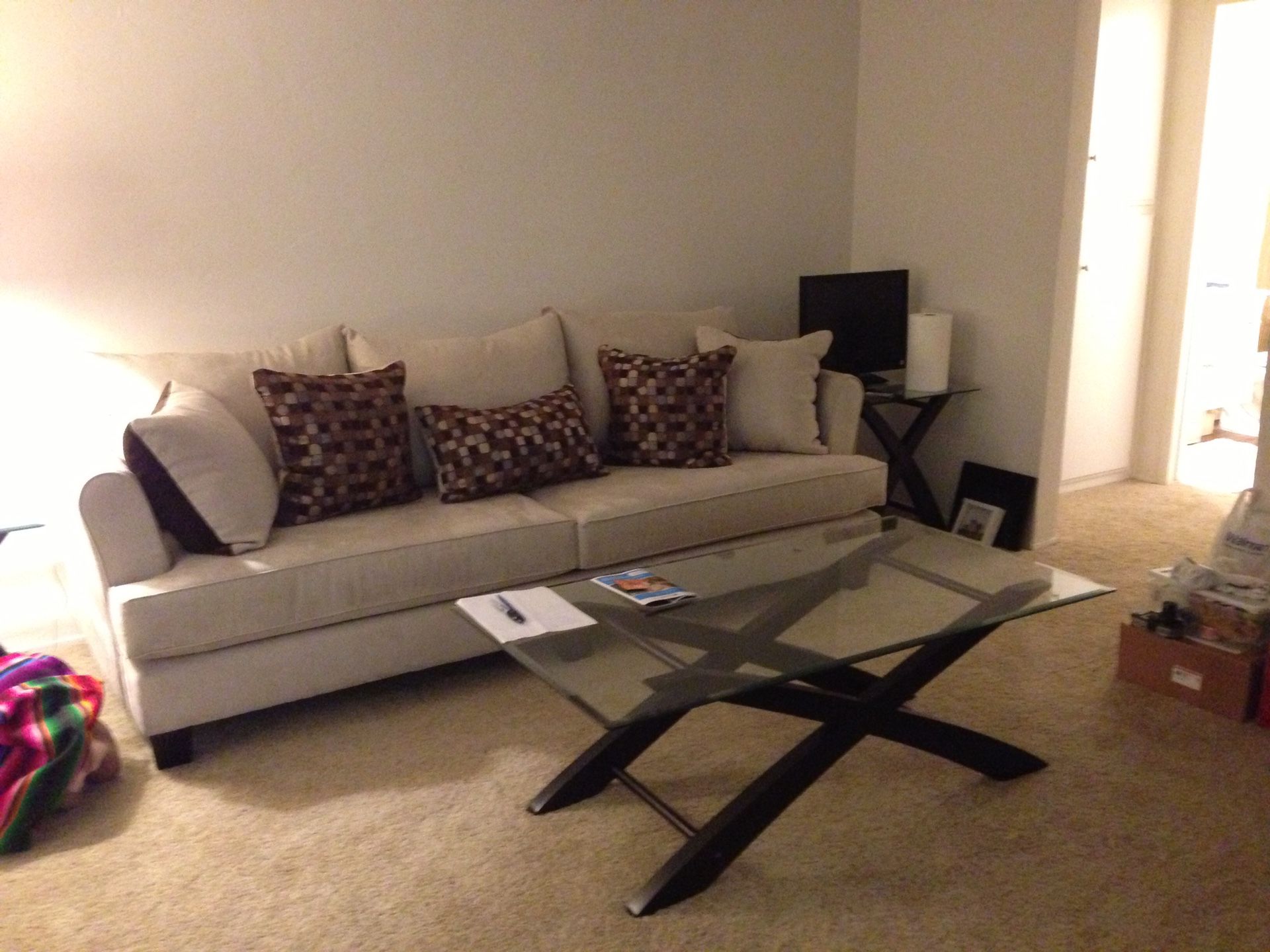 Sofa, Coffee table and two glass end tables.