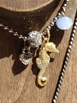 2 Beautiful Silvertone Necklaces, $20.00