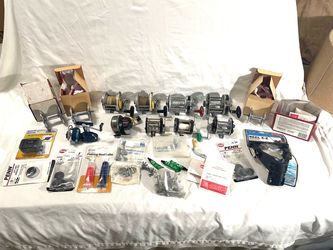 Big collection of older model bait, caster fishing reels with lots of new Penn repair supplies replacement parts.