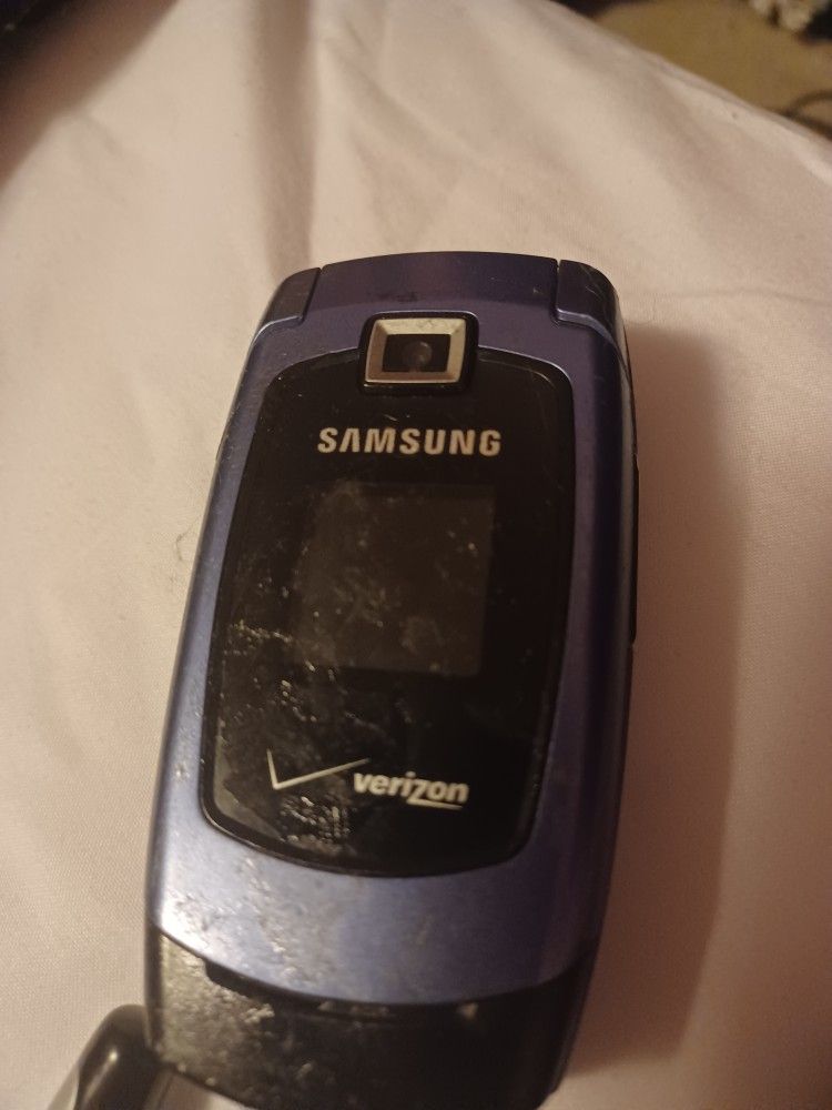 Old Cell Phones And Blue Tooth Ear Pierce 