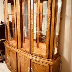 Lighted Large Oak China Cabinet by Arcese Brothers of Canada 2 pieces w/glass shelves. Matching Table and 4 chairs also available. Pickup in Tampa 336