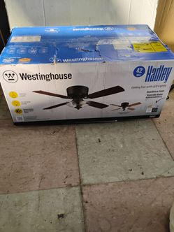 Westinghouse Hadley 42-Inch Ceiling Fan with LED lights, a black bronze finish, and reversible blades in Applewood or Cherry. 73112