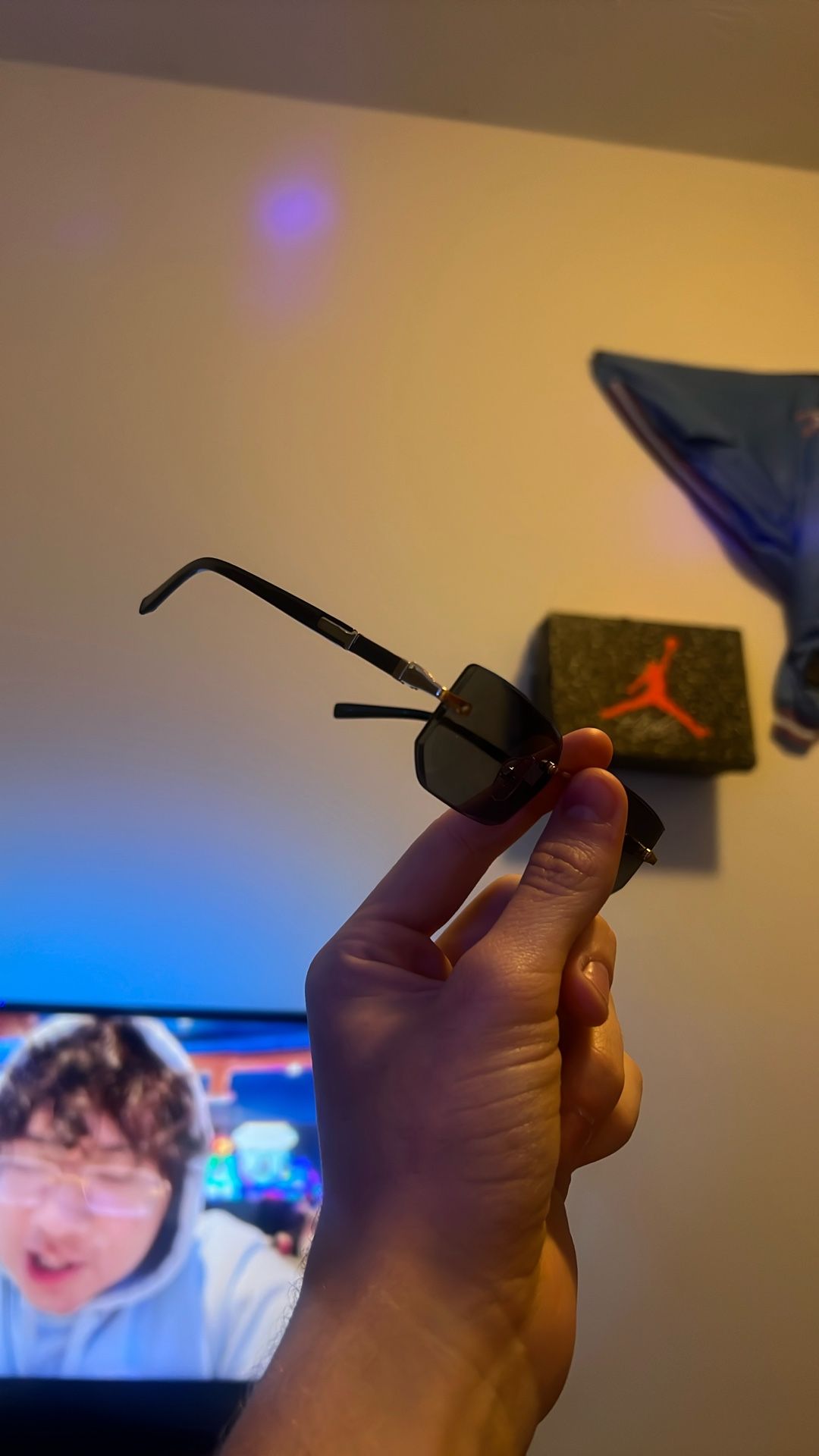 Black and gold frameless sunglasses