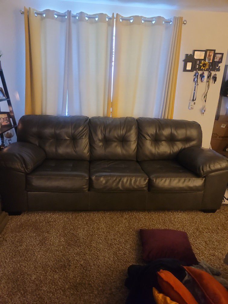 RARELY USED GREY LEATHER SOFA AND LOVE SEAT