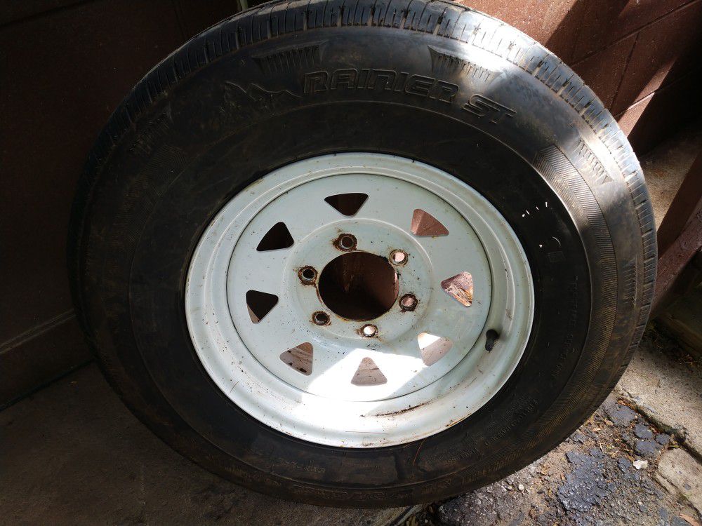 4 - 225/75R/15 Trailer Tires on white spoked rims