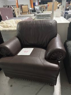 Brand new brown accent chair.