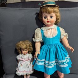 TWO VINTAGE DOLLS, ONE SHIRLEY TEMPLE 12" AND LARGER DOLL IN BLUE DRESS 22"