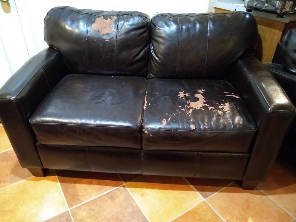 FREE: Worn Leather Loveseat with Matching Chairs and Ottoman