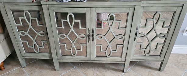 Consol Or Accent cabinate with intricate design of mirrors  for lobby or family room.