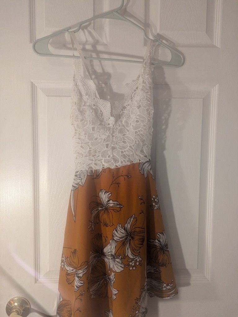 NEVER WORN. Sundress, White top and a Gold or burnt yellow Or Orange.