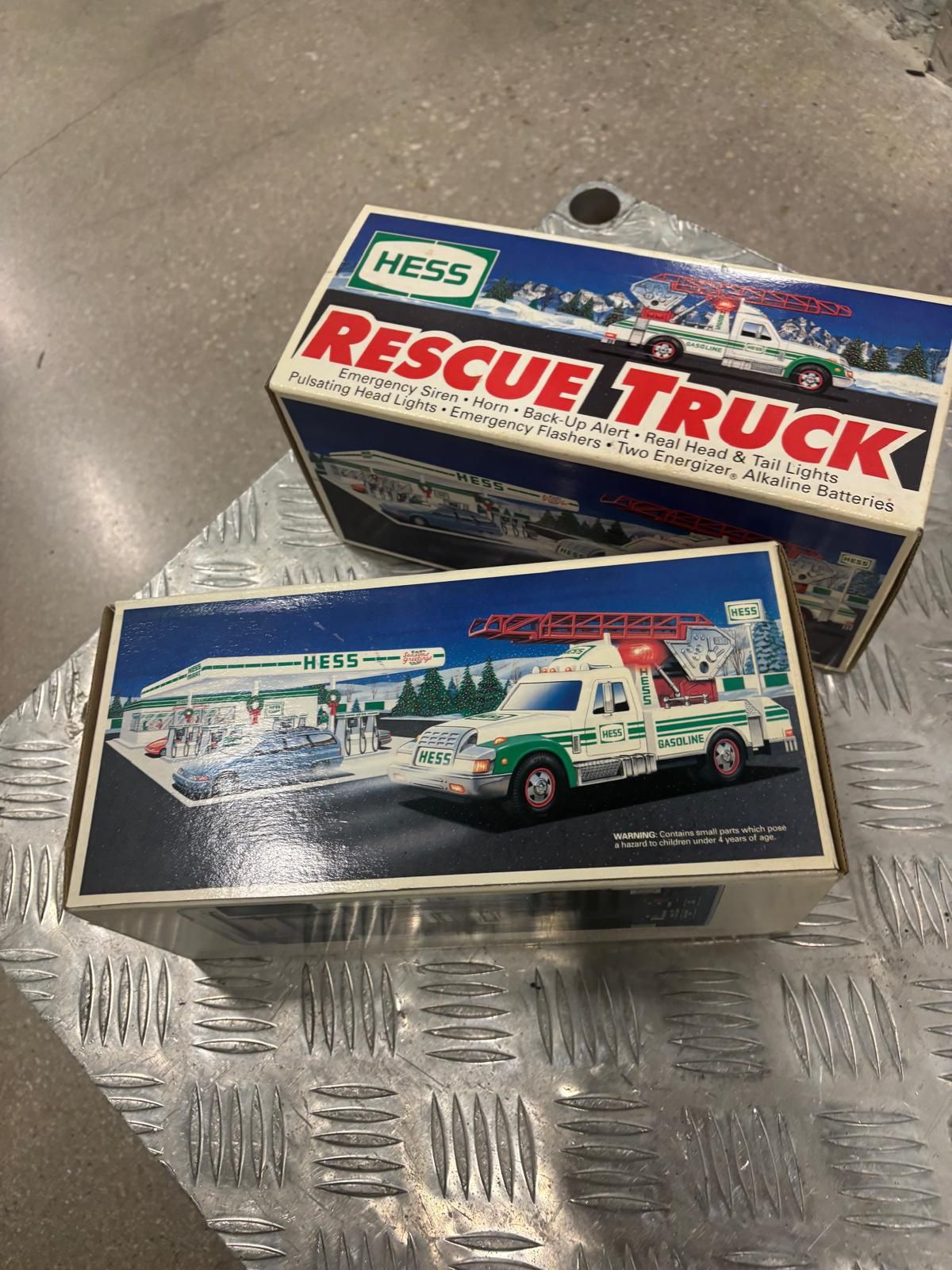 1994 Hess Rescue Truck- 2 collectible toy trucks released annually by Hess Corporation as part of a holiday tradition.. brand new in the original box