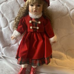 Brunette porcelain Christmas doll in red dress Vintage 