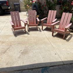 Four wooden patio chairs.