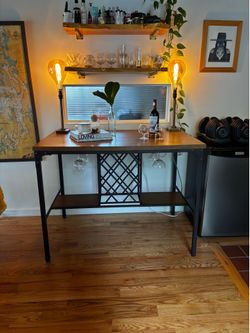Industrial bar table with wine glass storage