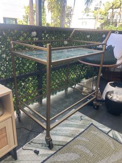 Brushed gold + glass bar cart