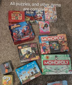Bundle all for 15 includes Mega construx, dog man books, monopoly board games, geo blocks, Winnie the Pooh baby books, Super Mario, puzzles.
