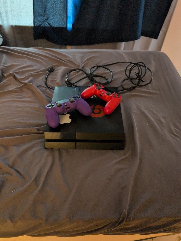 PS4 Console + 2 Controllers + Cords – Good Condition
