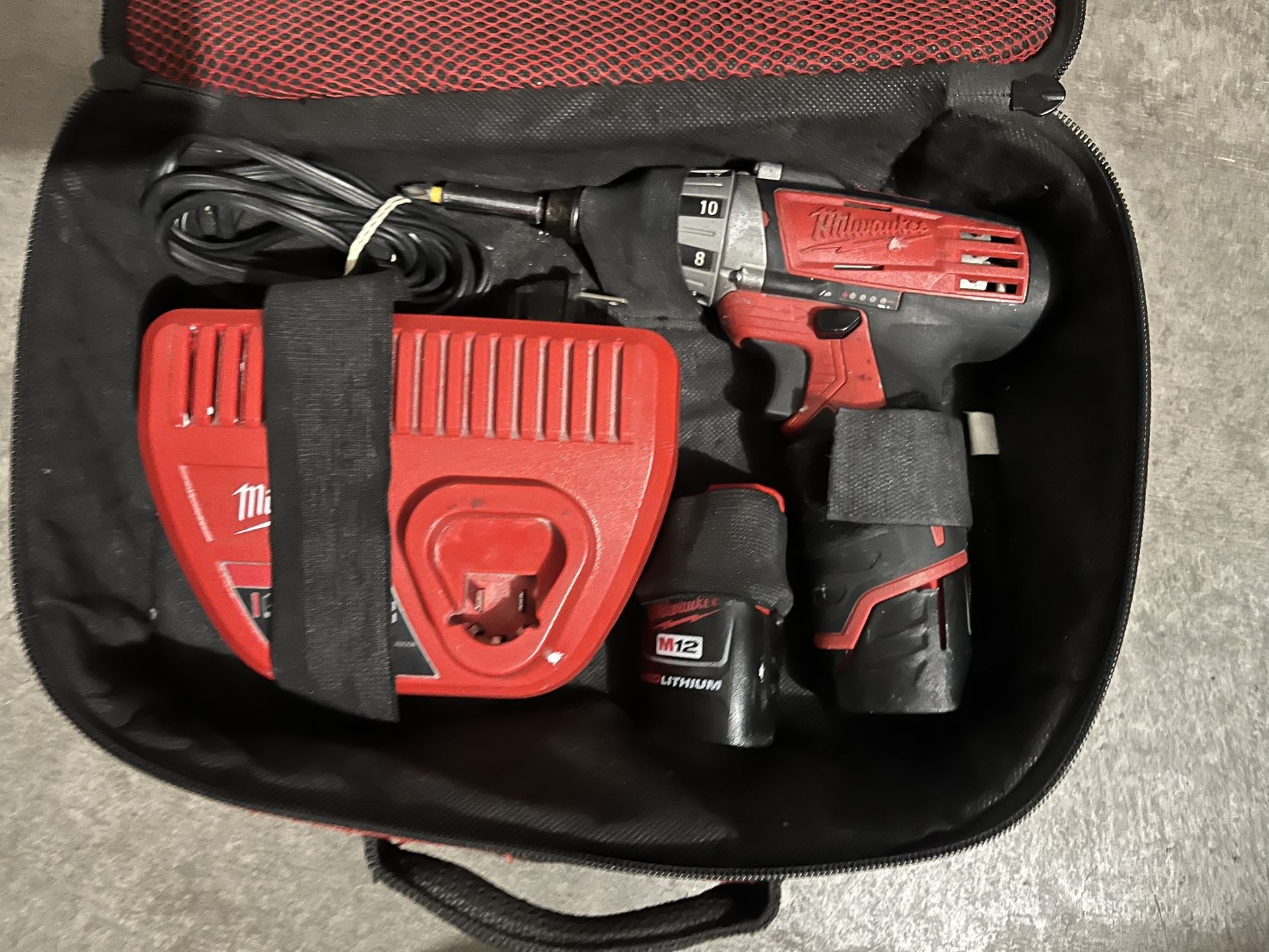 Drill Charger And 2 Batteries 