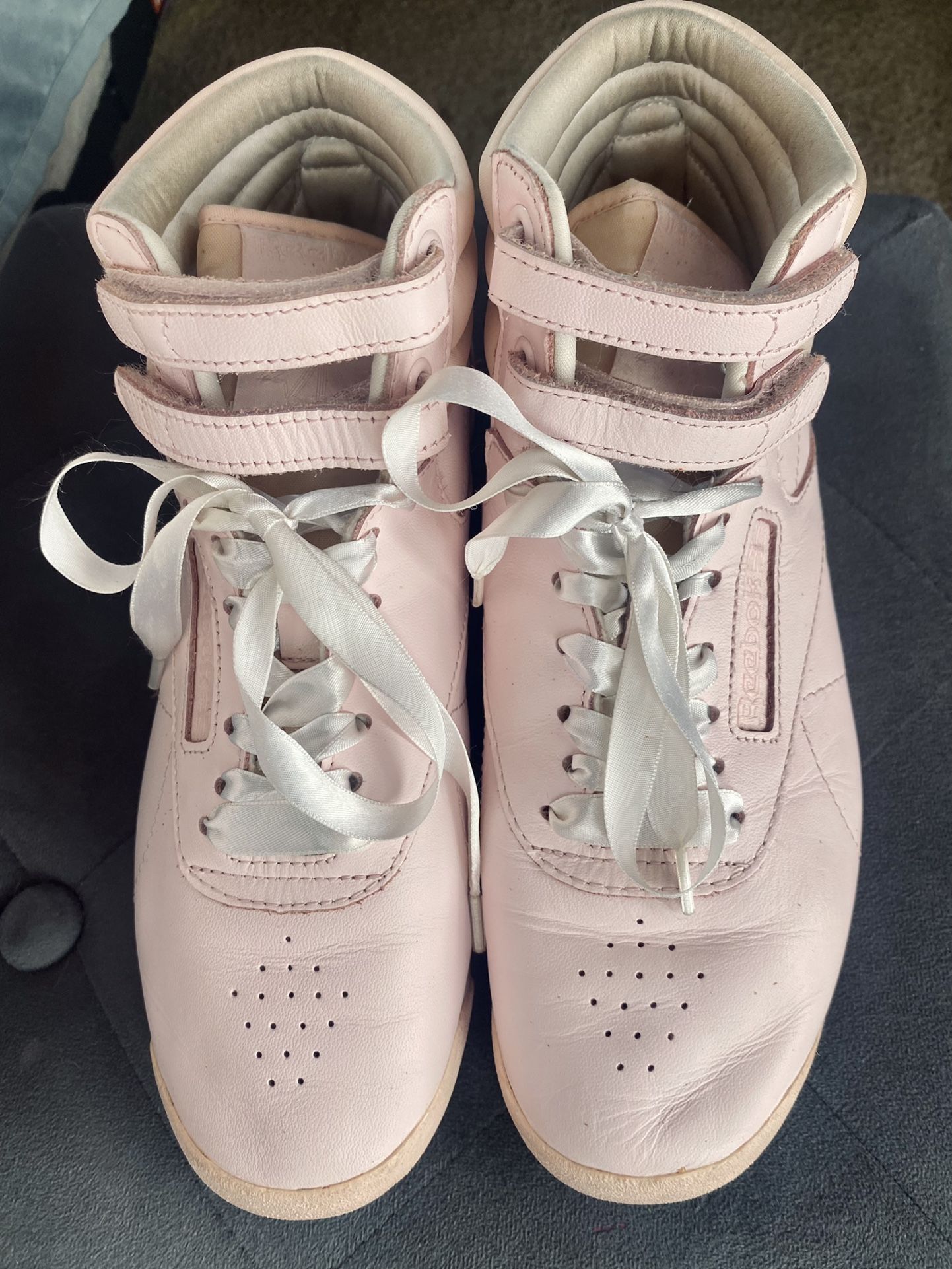 Woman’s Hightop Reeboks athletic shoes