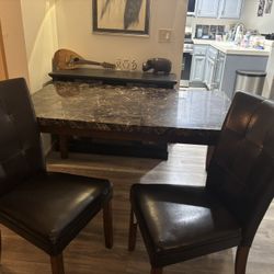 Wood table with 4 leather chairs 