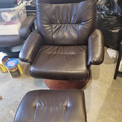 Brown Leather Swivel Chair And Ottaman 