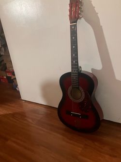 Red La Grima guitar for beginners