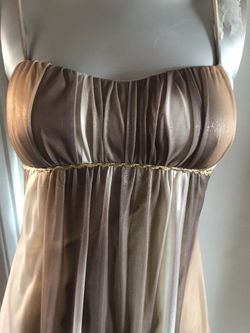 Woman’s gold dress