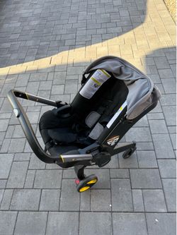 DOONA car seat stroller, 2 car seat bases, and newborn inserts