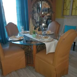 Beautiful solid wood and leather chair dinette set table opens at bottom for arrangement..Chain cabinet has 3 glass shelves and wine rack with lightin