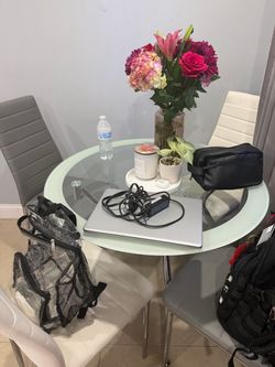 Glass table with all 4 chairs need gone asap