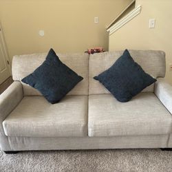 Mahoney Sofa In Pebble by Ashley 2 Seater With Cushions And Ottoman With Storage