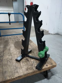 Sturdy black metal A-frame dumbbell rack has a five-tier design to store up to five pairs of weights.
This vertical stand helps organize gym equipmen