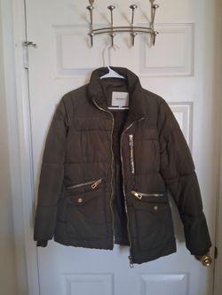 This How Dare U olive green quilted puffer jacket features a high collar and distinctive gold-tone hardware