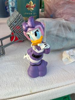 This is a toy figure of Daisy Duck as Darkwing Duck