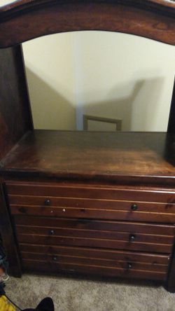 3 drawer dresser with a TV stand above that can hold a 33 inch.