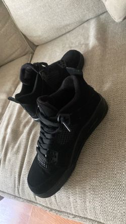 Black cat Jordan 4s