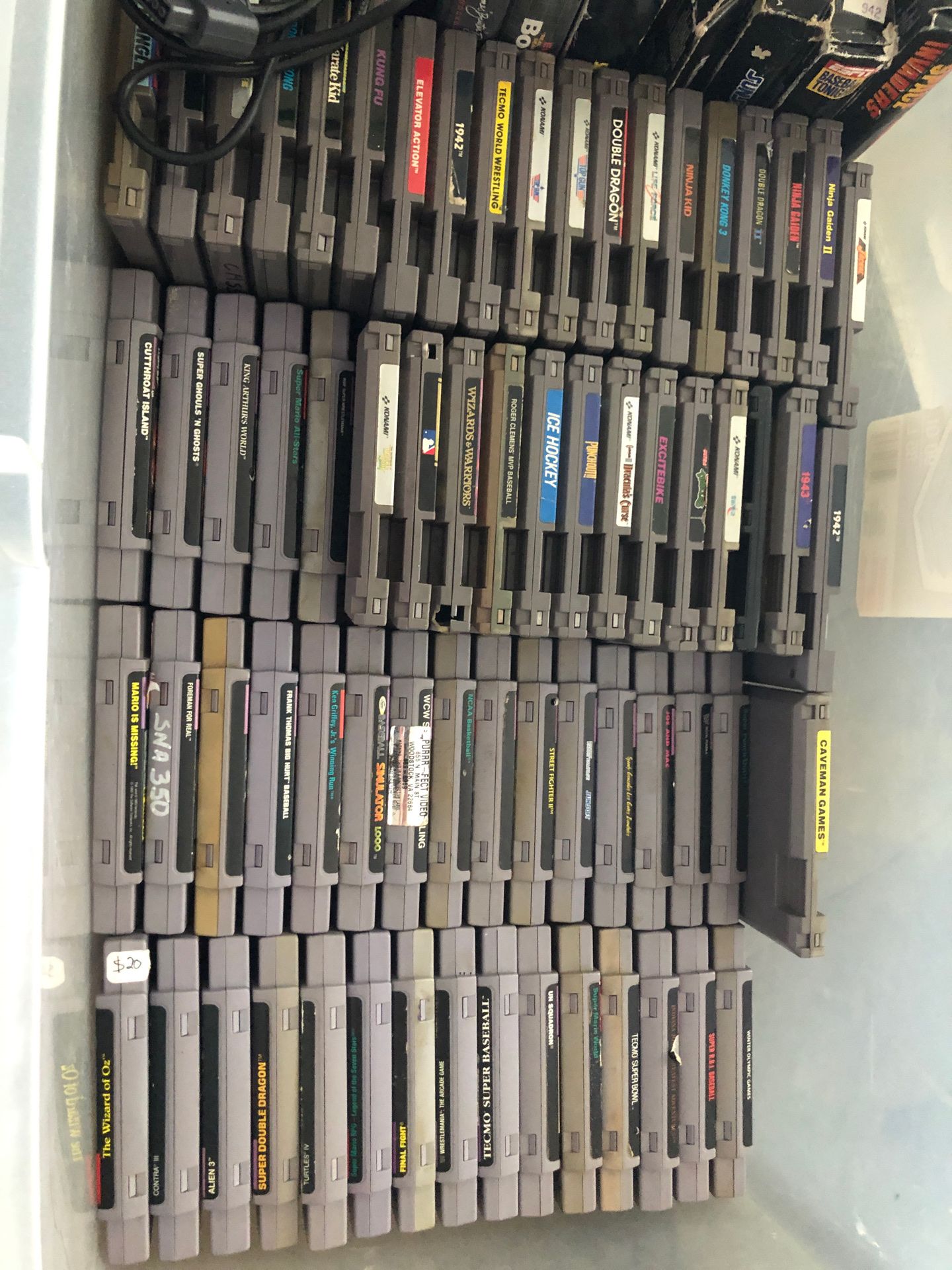 Lot of snes and nes games controllers and manuals