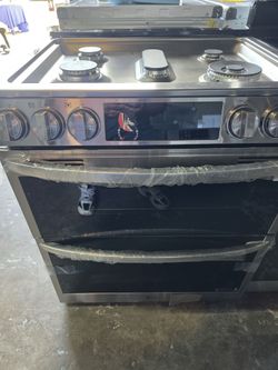 New LG gas stove-top range with double oven and air-fryer in stainless steel.