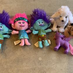 Trolls and stuffed animal lot.