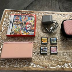 Nintendo DS lite pink console with 4 ds games Mario and disney tangled