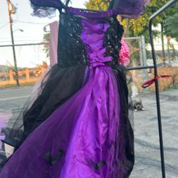 A little purple and black dress for a little wedge size small or maybe eight year-old